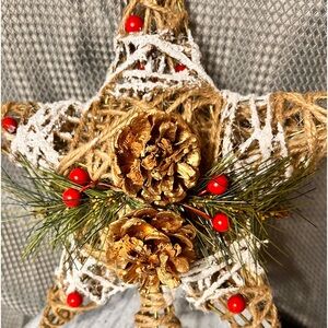 Country Christmas decor about 10 inches by 7 inches with twine and pine cones